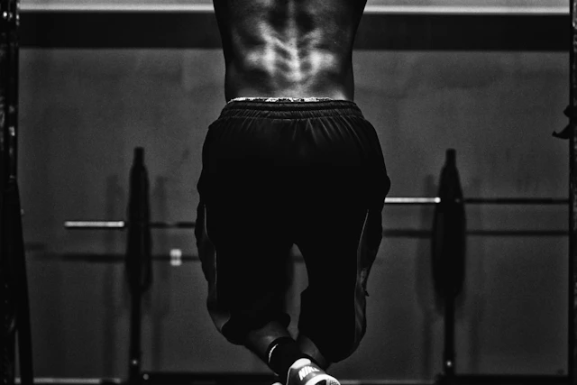 Hands gripping a pull-up bar