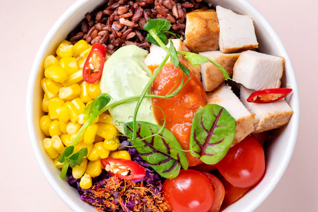 Adventist haystacks — beans, rice and vegetables stacked in a bowl