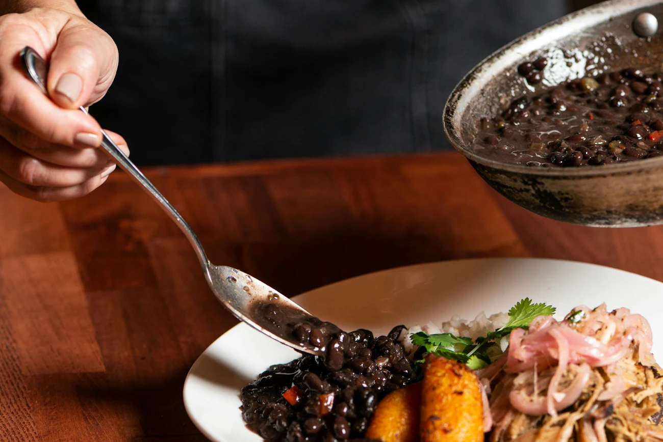 Three sisters stew — black beans, squash and corn in a rustic bowl with cilantro